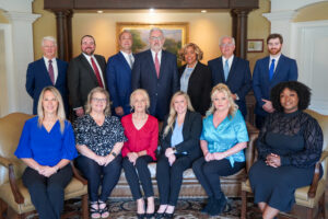 The attorneys and staff at Conchin Cole Jordan and Sherrod, an Alabama Personal Injury Law Firm pose for a photo in their office in Huntsville.