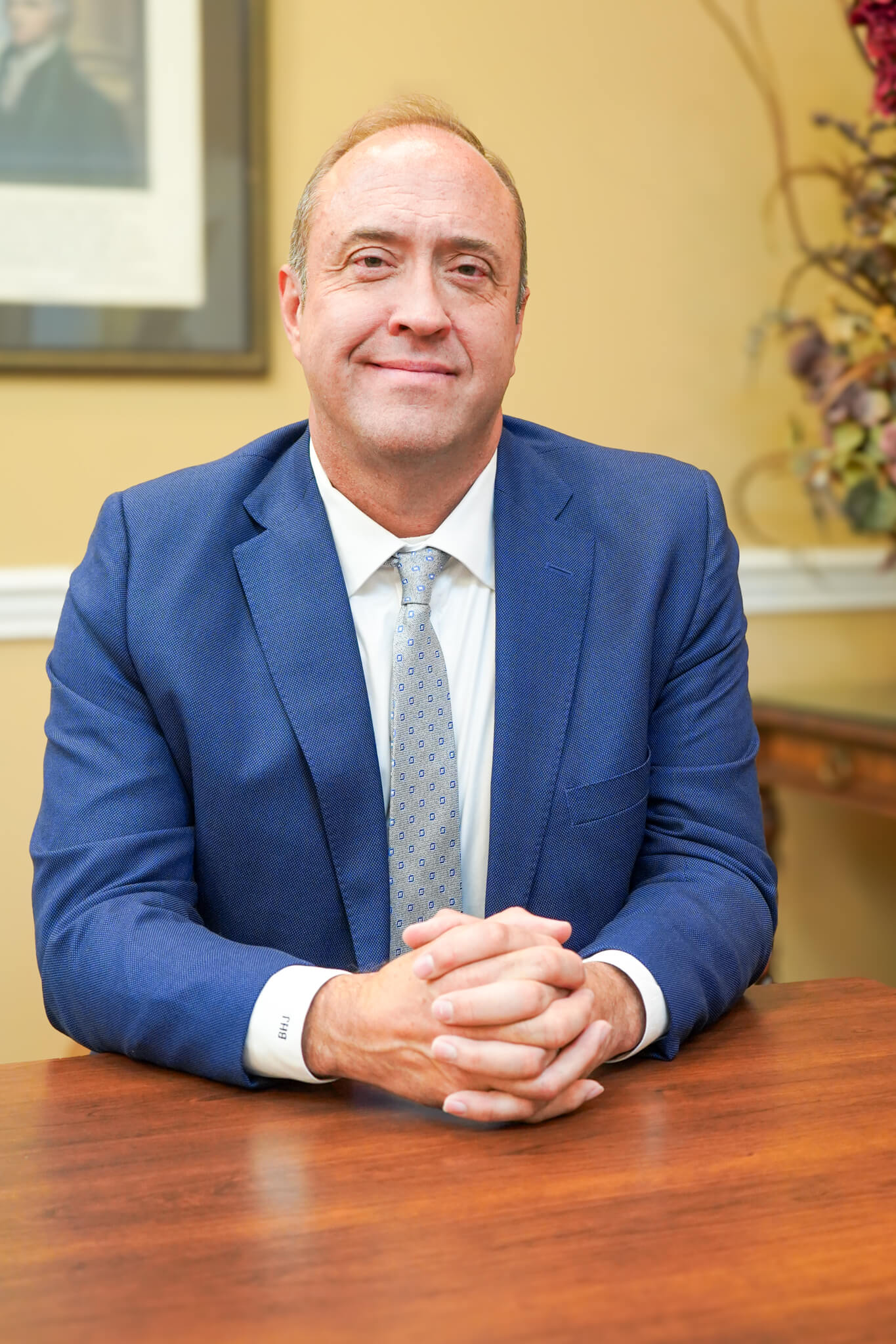 Personal injury attorney Brent Jordan smiles for a photo while sitting at a conference table at their office in Huntsville, Alabama